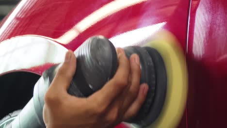 polishing a red car