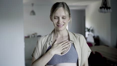 front view of calm beautiful woman practicing breath exercises