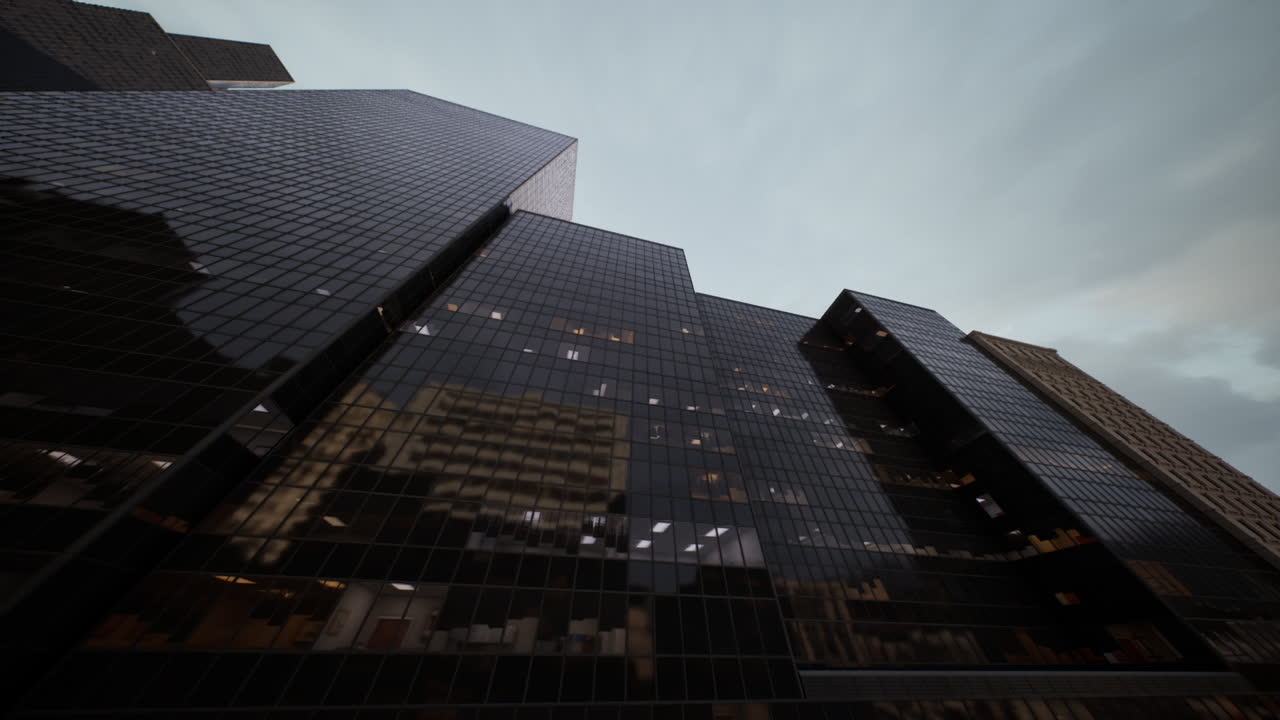 Modern skyscrapers reflecting a cloudy sky in a bustling urban environment