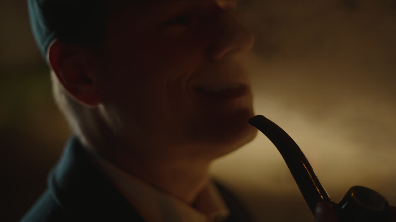 Man Smoking a Pipe in the Dark
