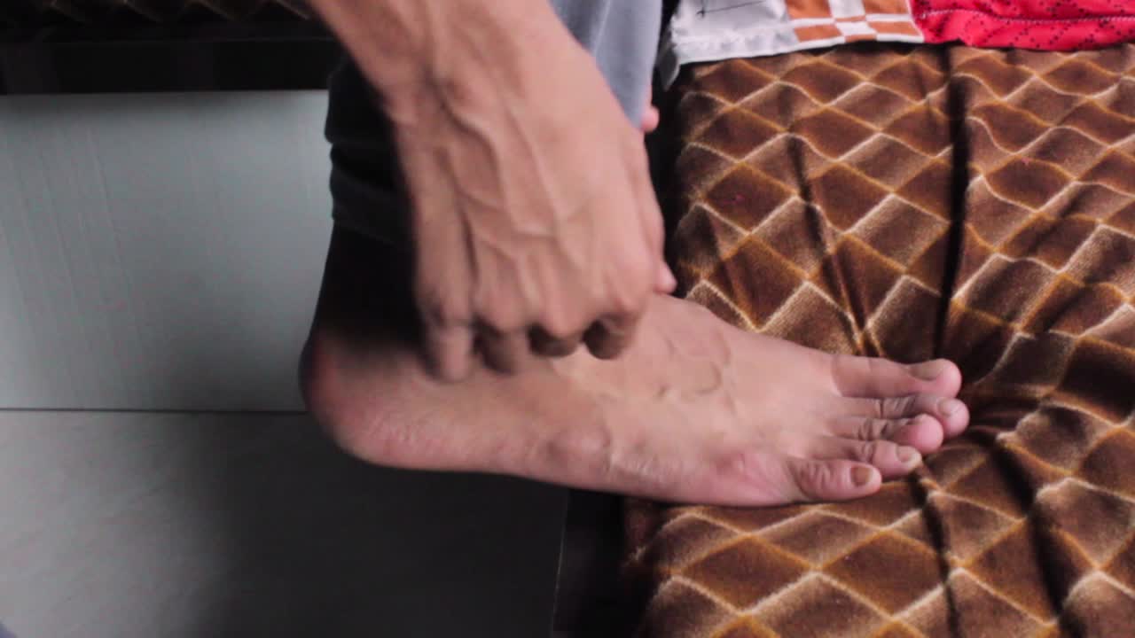 Man cuffing his pants