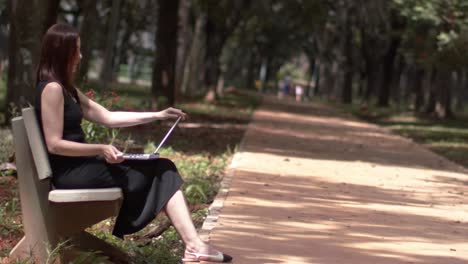 in idyllic setting young woman takes brief respite from digital whirlwind