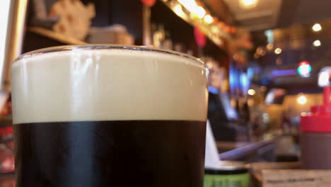 dark beer with foamy head