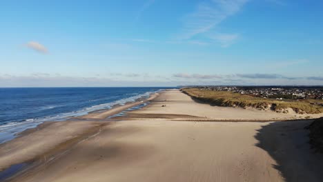 Aerial-view-of-the-North-Sea-shoreline-outside-Løkken,-Denmark