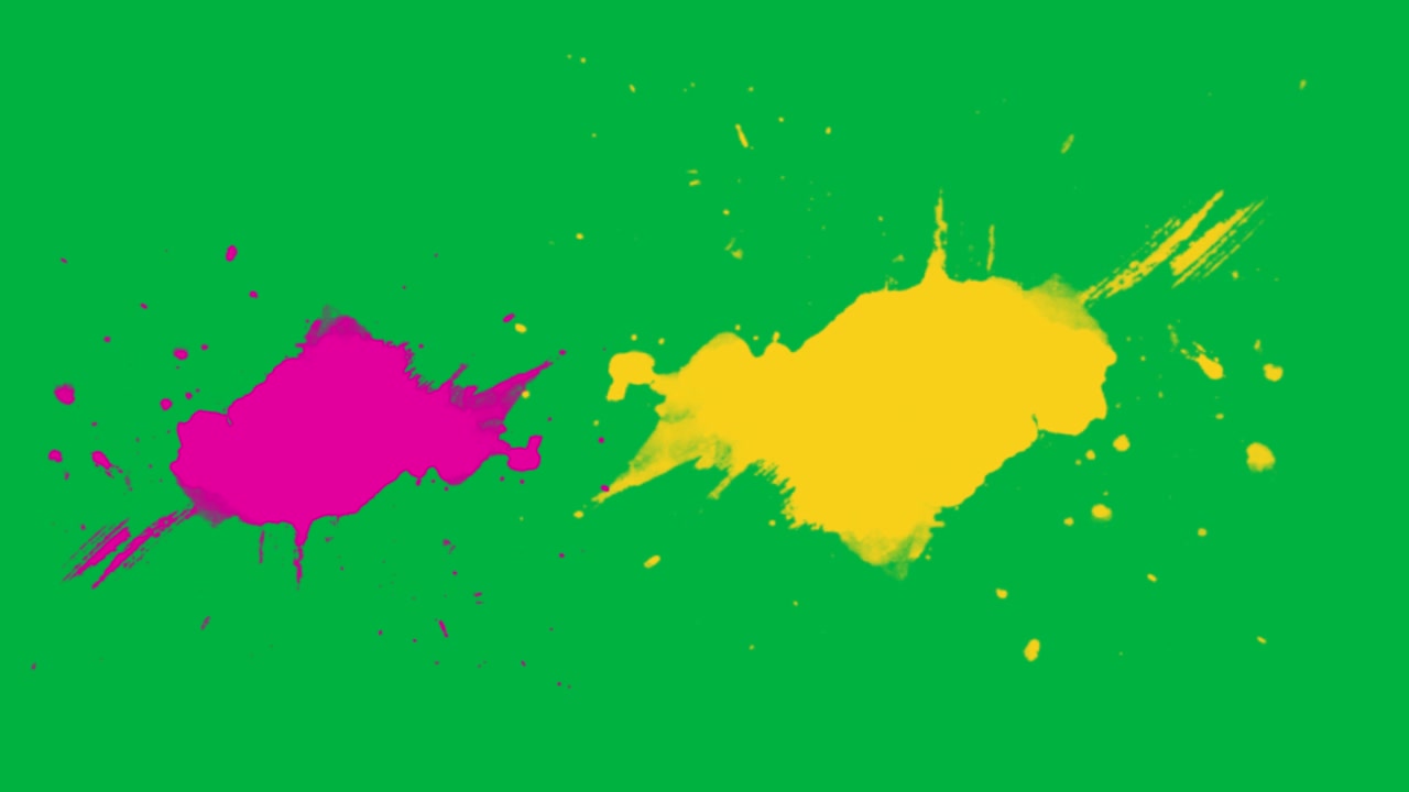 Schizzi di vernice gialla e rosa su sfondo green screen