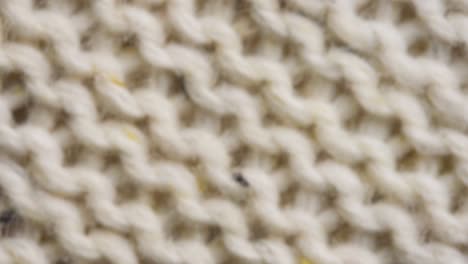 knitted fabric threads macro. beige sweater