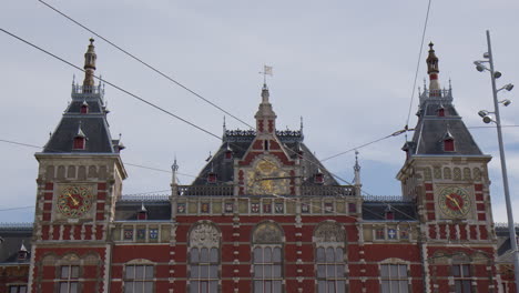 exterior of amsterdam centraal, amsterdam central station in netherlands. wide shot