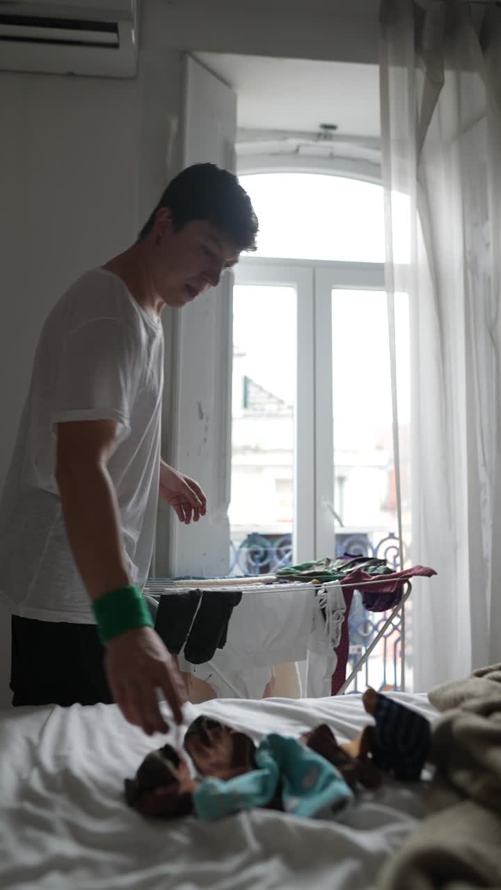 Young Person Doing Laundry in a Bedroom