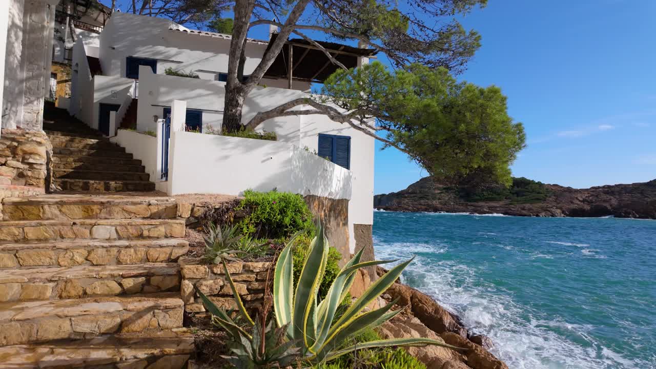 Tamariu Beach in Costa Brava de Girona super slow motion white houses in front of the Mediterranean Sea