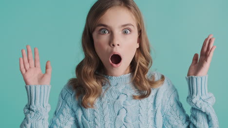 surprised teenage caucasian girl in front of the camera.