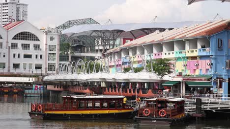 boat cruising by vibrant waterfront architecture.