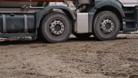 heavy-duty truck on muddy construction site. perfect for industrial project visuals