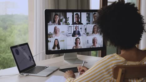 group of diverse businesspeople involved in discussion through videoconference