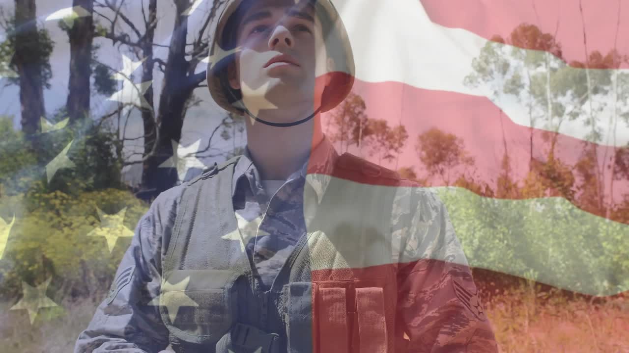 Soldier tapping defense tablet swiping data and scanning sky overlaying flag graphic for vigilance