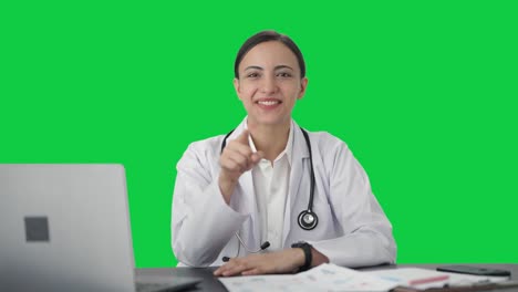 Happy-Indian-female-doctor-talking-to-the-patient-Green-screen