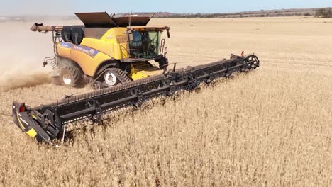 this footage captures the synergy of modern agricultural technology, showcasing the essential role of header fronts in the wheat harvesting process