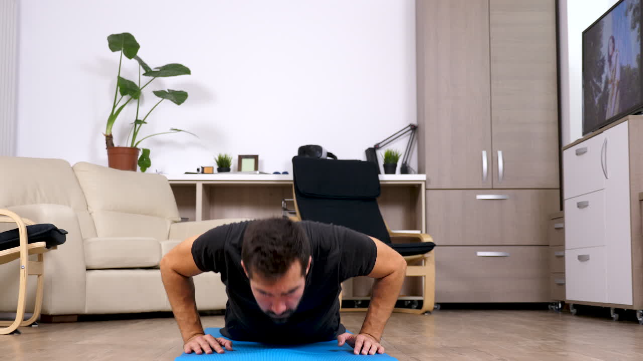 Man doing push ups at home