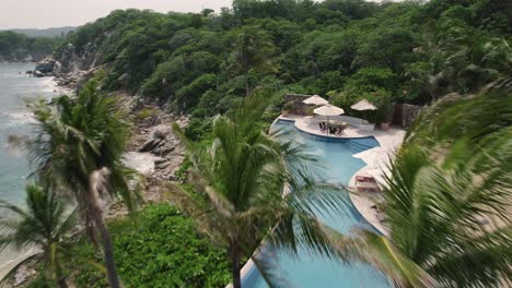 aerial of villa at mesmerizing coastline in huatulco, mexico