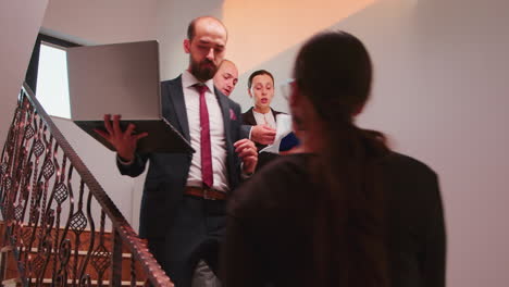 office executive holding clipboard pointing on it