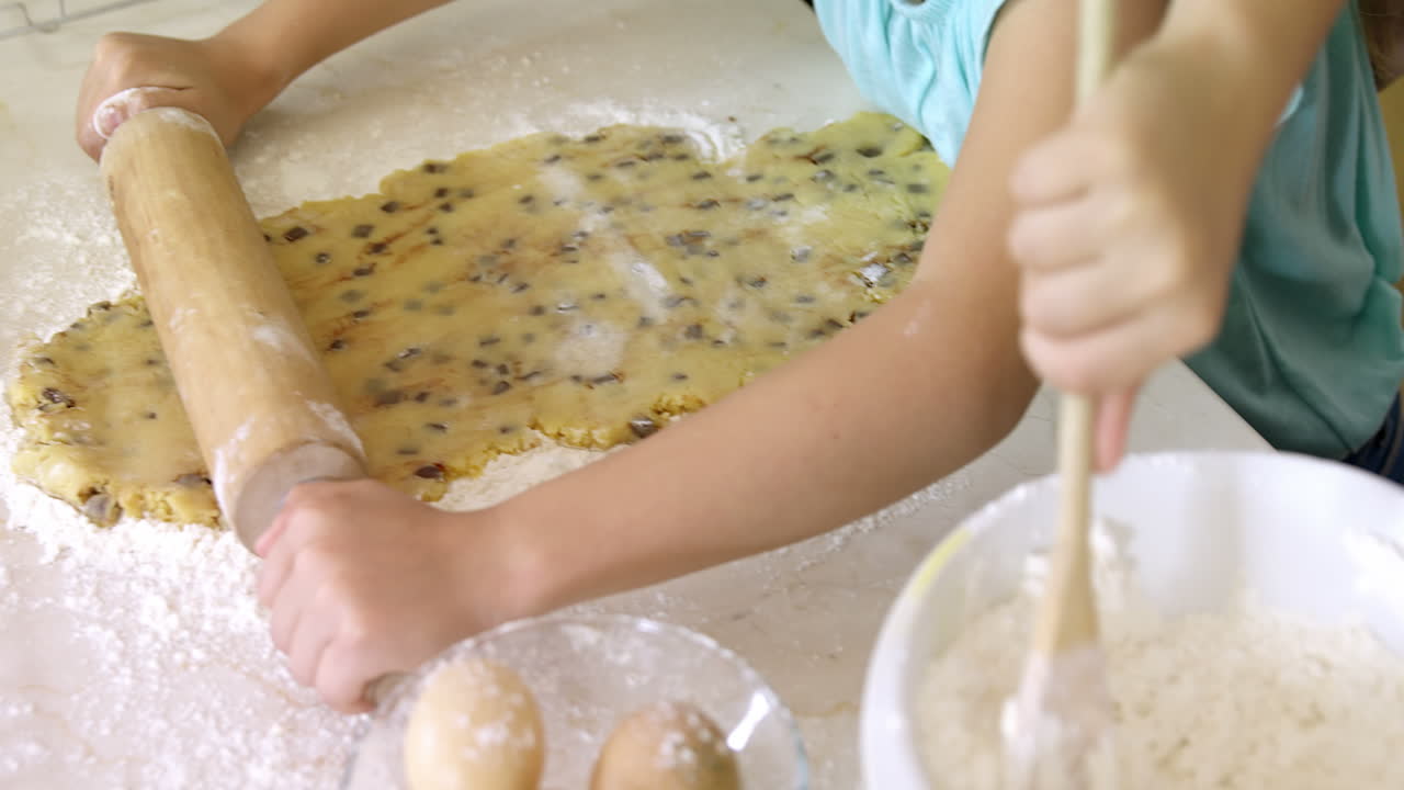 Kids preparing dessert in kitchen