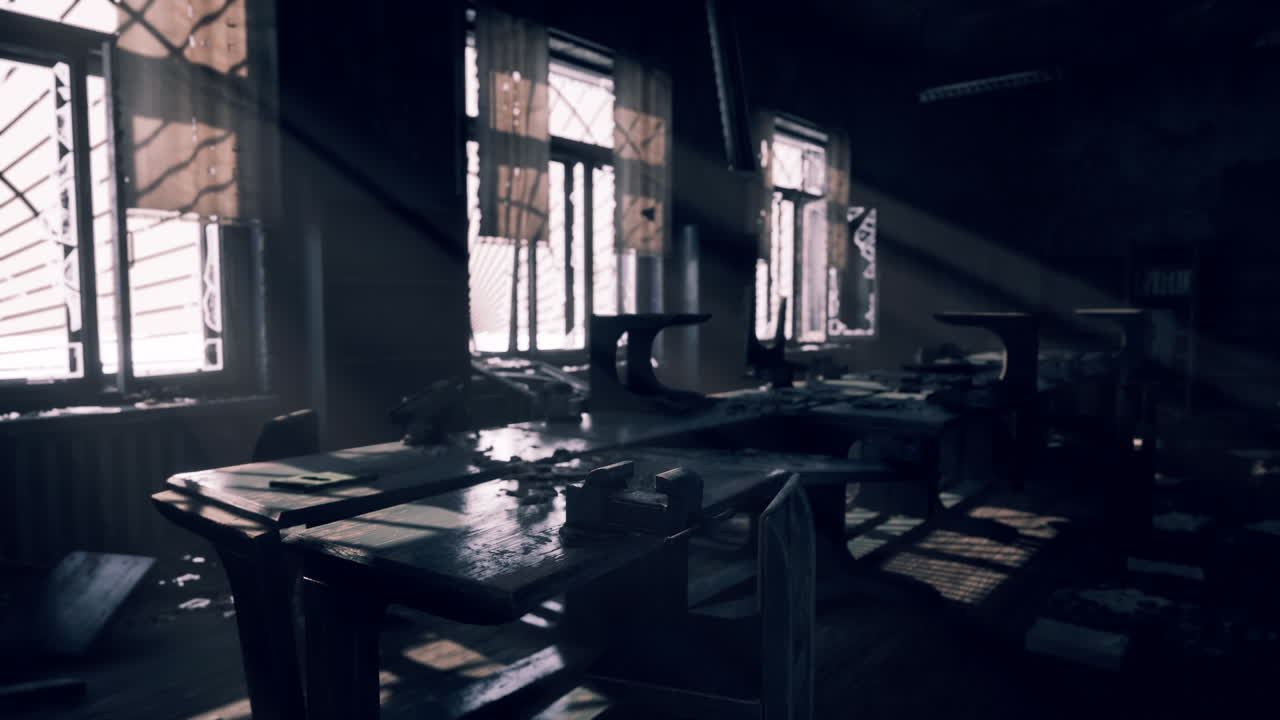Abandoned sewing workshop with sunlight streaming through dusty windows