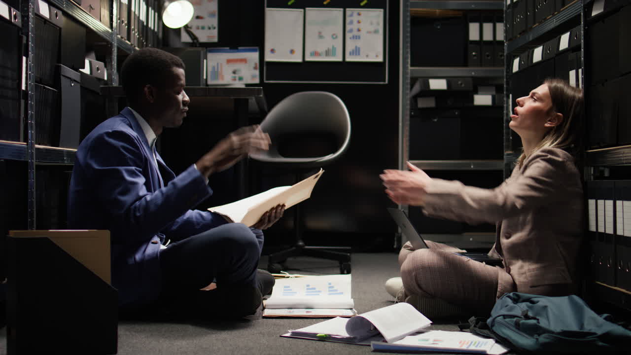 Business professionals working in an office storage room