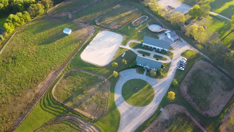 drone shot of horse ranch with training ring