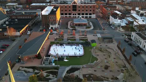 people skating at downtown common ice rink in clarksville, tennessee, usa