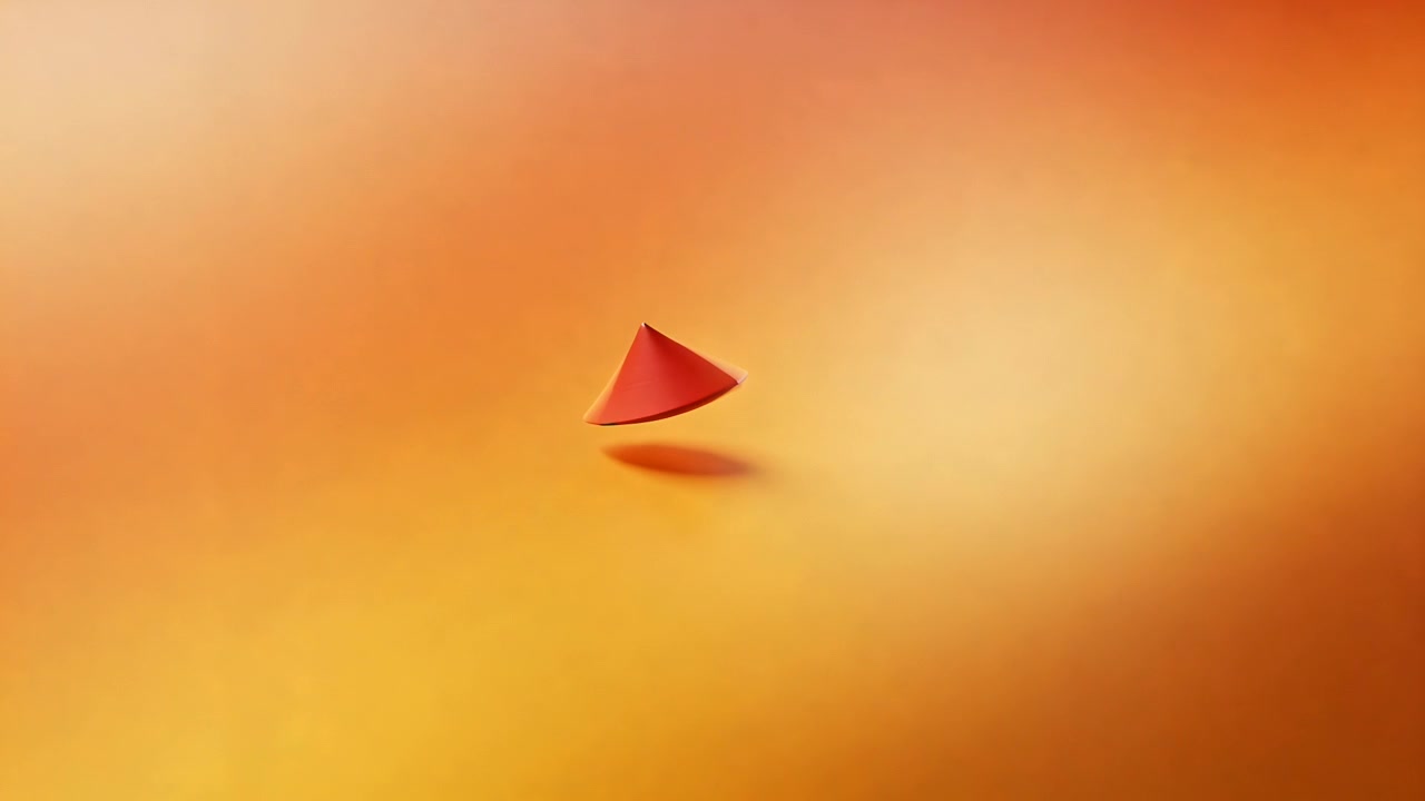 Starting frame red cone rising and rotating in studio casting oval shadow from lighting shift