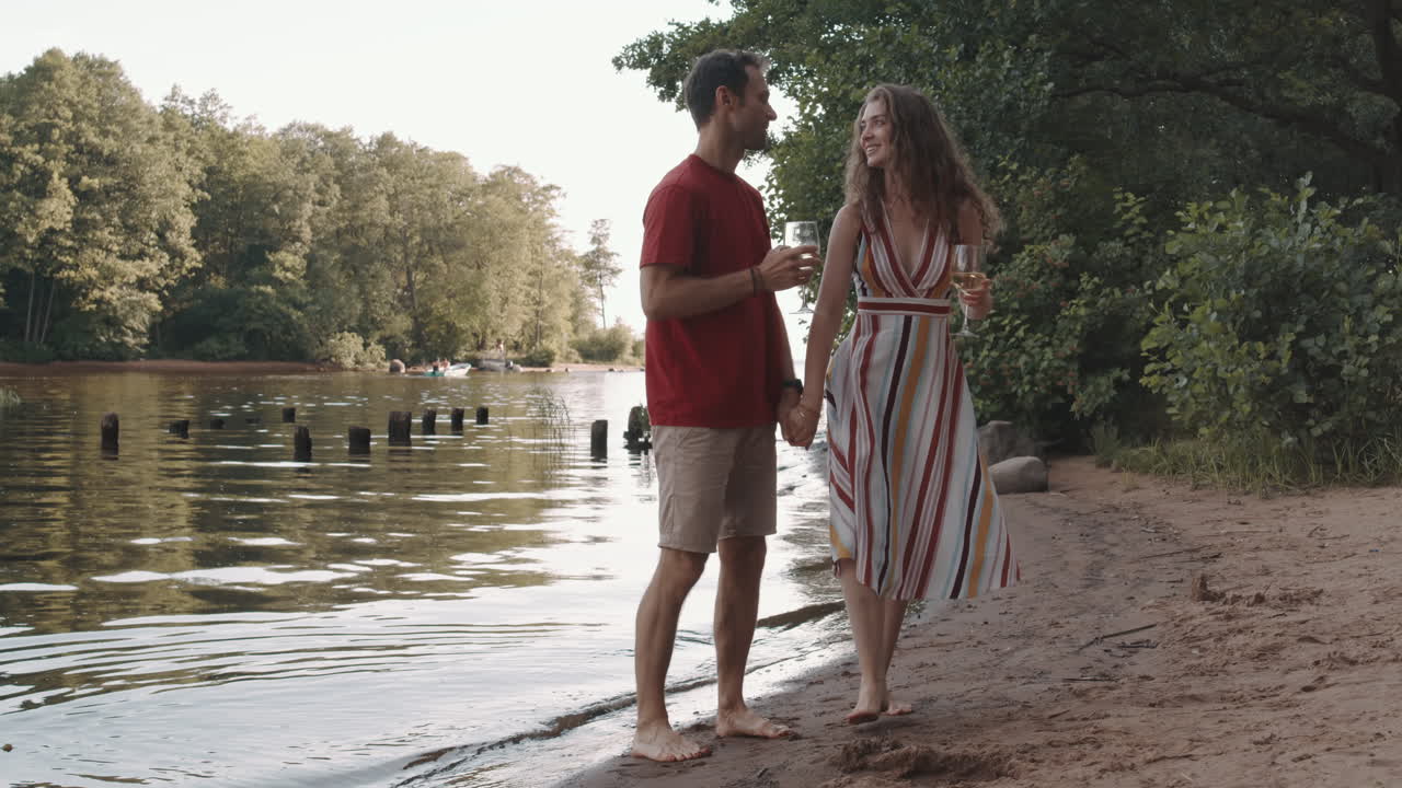 Couple Walking by Pond Shore