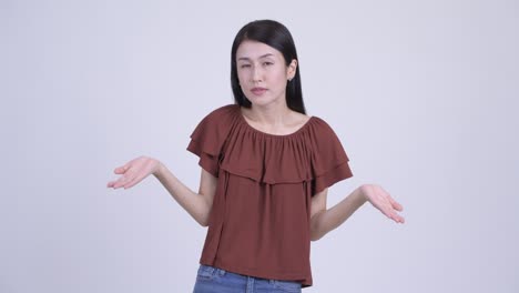 stressed asian woman looking confused