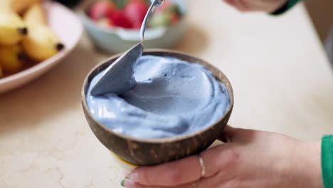 Smoothie,-bowl-and-hand-of-woman-prepare-breakfast