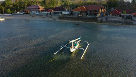 clockwise drone fly over balinese sailing boat