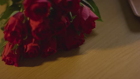 close up of bunch of red roses for valentines day on table 2