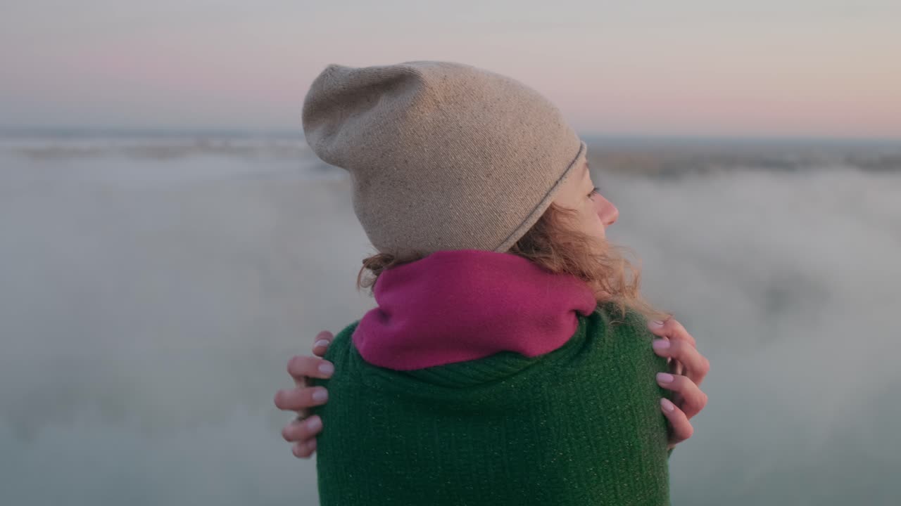 Woman Embracing the Misty Mountain View
