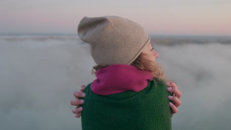 woman embracing the misty mountain view