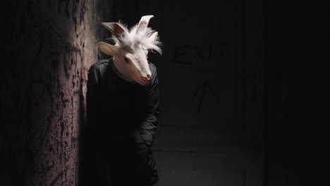 goat mask in a dark alley
