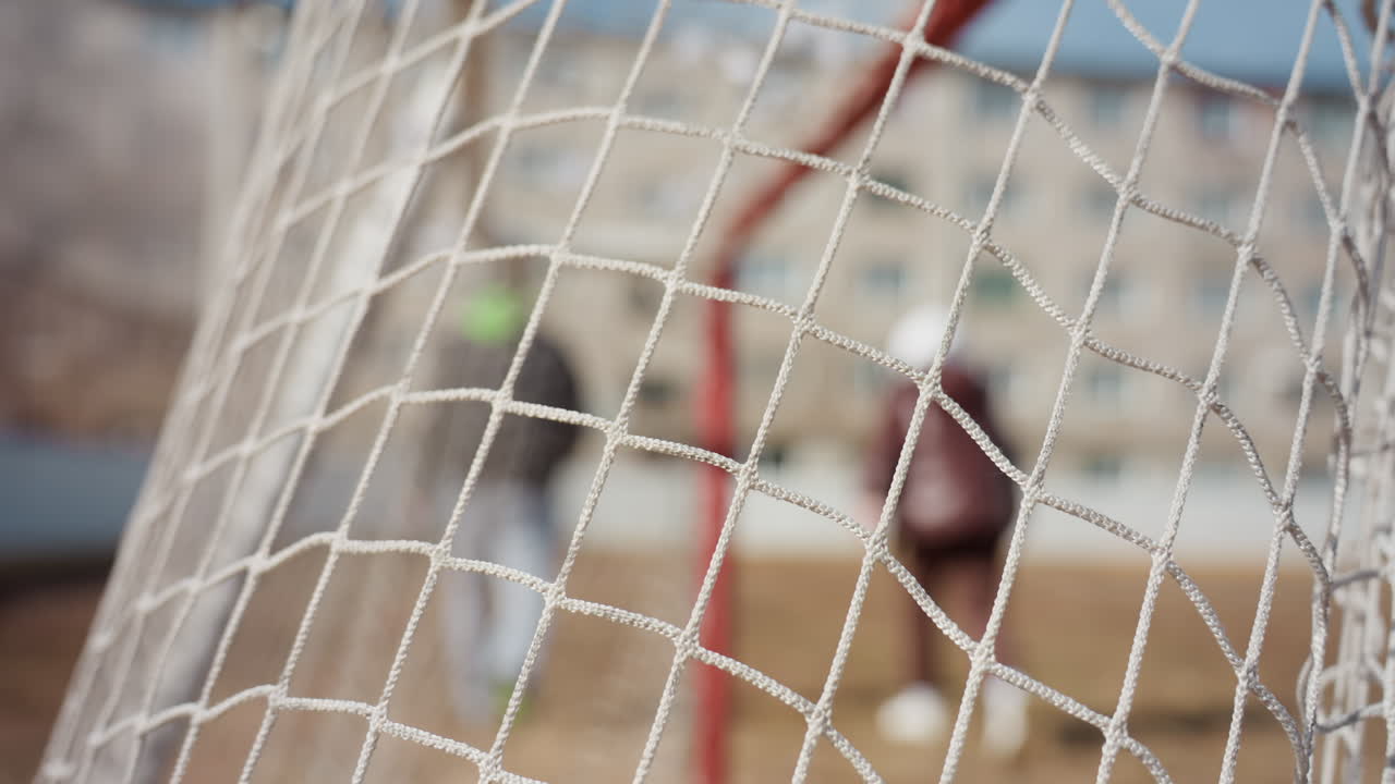 football nets celebration, closeup of ball and net, exciting moment capturing ball contact and stadium atmosphere, intense scene of soccer ball striking net during vibrant game celebration