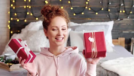 portrait of smiling girl showing the christmas present