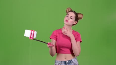 woman taking selfie with selfie stick