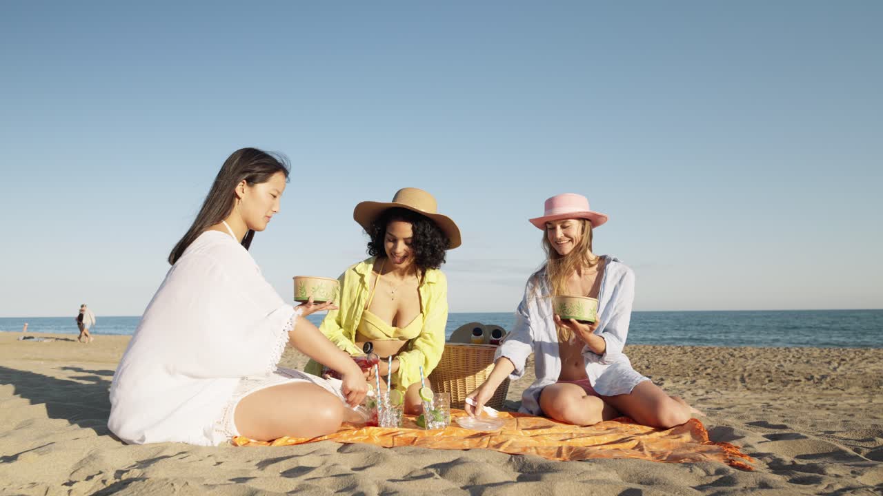 Women enjoying a picnic on the beach