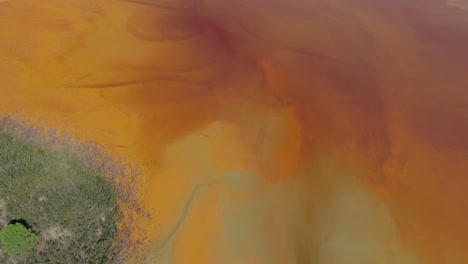 aerial view of the red copper-colored lake in