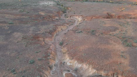 aerial ascending dry creek arid location of wilpena pound, australia