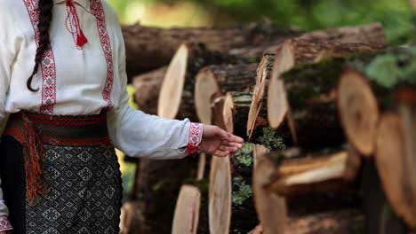 romanian girl touches the cut trees 4