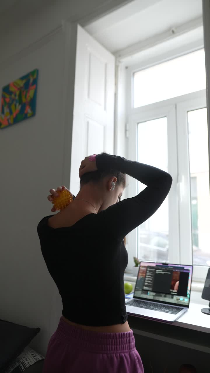 Woman Stretching Her Neck and Shoulders at Home