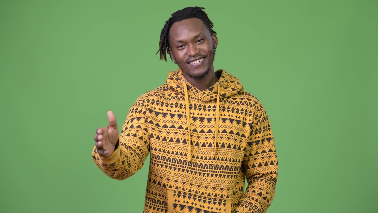 Young handsome African man giving handshake