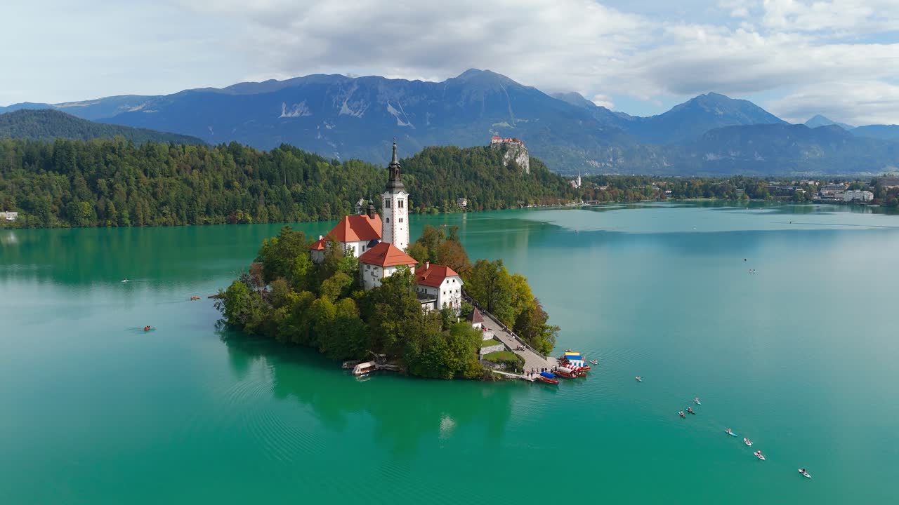 Aerial view of Lake Bled Island with serene castle and mountains