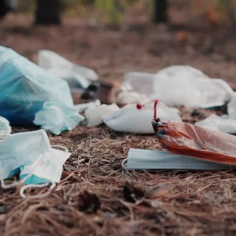 plastic bag with trash and many used masks