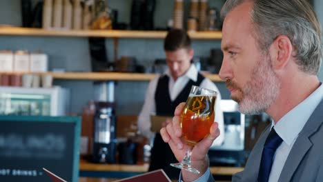 Man-tasting-wine-in-front-of-the-waiter