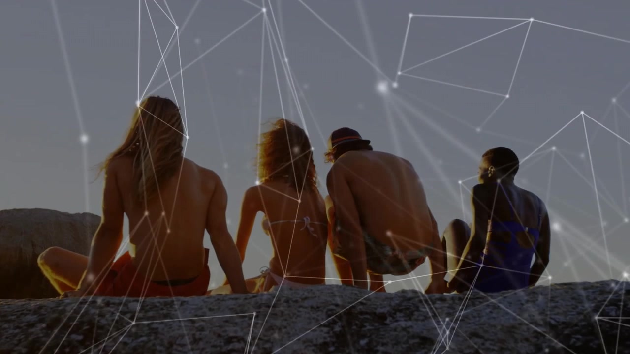 Travel group watching sun descending on ledge, one adjusting seating overlay pulsing overhead